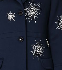 a blue coat with white stars on it