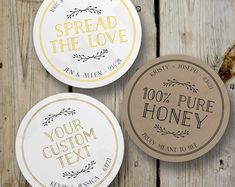 three wedding stickers with the words spread the love and 100 % pure honey on them