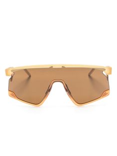 orange acetate metal navigator frame brown tinted lenses UV-protective lenses logo plaque at the arm sculpted arms curved tips These glasses come with a protective case.