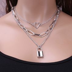 Beautiful triple necklace can be used for any occasion. Featured in silver and gold First Layer Chain Length: 19.69 in; Second Layer: 16.54 in; Third Layer: 14.57 in; Extension: 2.76 in; Lock Size: 0.59x0.98 in (approximate measurements) Material: Alloy **Colors may appear slightly different on-screen than in-person. Lock Chain Necklace, Triple Necklace, Layer Chain, Lock Chain, Layered Necklaces Silver, Lock Necklace, Layered Chains, Gold Necklace Layered, Girls Jewelry