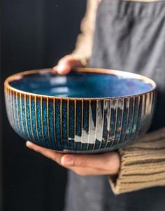 a person holding a bowl in their hands