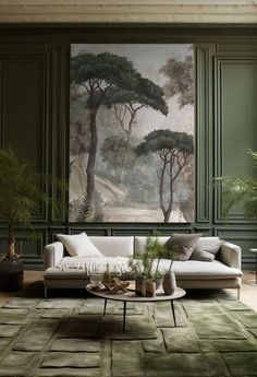 a living room with green walls and paintings on the wall