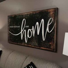 there is no place like home sign on the wall in this living room that says,