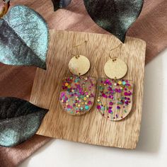 Festive Gold Glitter Jewelry, Iridescent Glitter Earrings As Gift, Multicolor Glitter Dangle Earrings, Iridescent Glitter Earrings For Gift, Iridescent Glitter Earrings For Party, Multicolor Glitter Drop Earrings, Glitter Drop Earrings As A Gift, Multicolor Resin Jewelry With Glitter, Festive Gold Sparkling Earrings