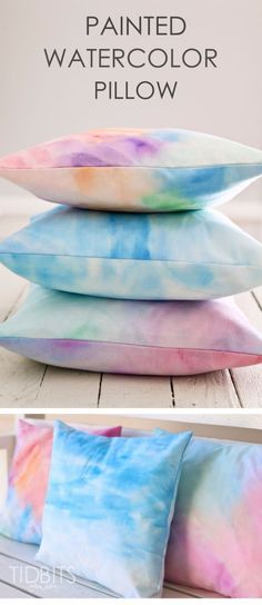 three pillows that have been painted with watercolors and the words pillow written on them