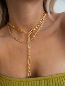 Gold Elegant Lariat Necklace, Gold Dangle Chain Necklace For Layering, Gold Dangle Jewelry With Double Chain, Gold Lariat Figaro Chain Jewelry, Gold Long Necklace With Figaro Chain, Gold-plated Lariat Necklace For Party, Chic Lariat Chain Necklace, Yellow Gold Lariat Jewelry For Party, Figaro Chain Toggle Necklace As Gift