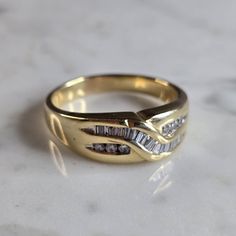 A Mens Vintage Estate 14k Yellow Gold Diamond Ring. There Are 0.45cts Of Diamonds. The Total Weight Is 10.2g, And Is A Size 13.25. The Width Of The Ring Is 5/16". Any Questions Please Dont Hesitate To Ask. Be Sure To Check Out Some Of Our Other Great Items Up For Sale. Thank You. Formal Yellow Gold Diamond Ring With Baguette Diamonds, Classic Gold Ring With Baguette Diamonds, Formal Yellow Gold Cluster Ring With Baguette Diamonds, Classic Yellow Gold Ring With Baguette Diamonds, Classic Cluster Ring With Baguette Diamonds, Yellow Gold Emerald-cut Diamond Ring With Channel Set, Emerald Cut Channel Set Yellow Gold Diamond Ring, 14k Gold Baguette Diamond Ring For Anniversary, Gold Cluster Ring With Baguette Diamonds For Anniversary