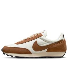 The Nike DBreak SE 'Rattan' is a stylish and comfortable women's sneaker that combines a classic running style from 1979 with modern materials. Its unique silhouette and texture make it stand out from the crowd. It is perfect for running, jogging, and other activities, and its brown and white colorway is inspired by the classic Nike Daybreak series. The rubber sole provides superior cushioning and support, making it a great choice for any woman who wants to look stylish while staying active. Release date: 2022-06-27. (SNKR/Retro/Low Top/Women's) Nike Vintage Sports Sneakers, Vintage Nike Sports Sneakers, Vintage Nike Sneakers For Sports, Retro Sneakers With Cushioned Footbed, Retro Nike Sneakers With Rubber Sole, Sporty Brown Nike Running Shoes, Vintage Nike Brown Sneakers, Vintage Brown Nike Sneakers, Nike Retro Brown Sneakers