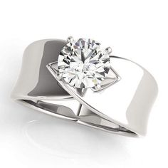 a white gold ring with a diamond in the center