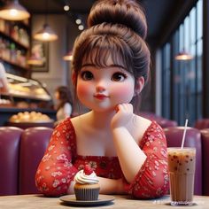 a doll sitting at a table with a cupcake and drink in front of her