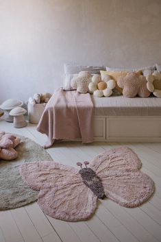 a bedroom with teddy bears and stuffed animals on the floor