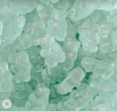 ice cubes that are green with white dots on the top and bottom, as seen from above