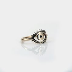 The Ojo Ring features a small, bright eye integrated into the band. - Eye measures ~ 1/2" x 5/8" Eye Rings, Key Jewelry, Bright Eye, Handmade Modern, Eye Ring, Single Earring, Modern Jewelry, Ring Bracelet, Earring Necklace