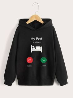 a black hoodie with the words, my bed is coming and two different buttons on it