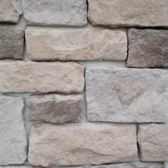 a close up of a stone wall with no mortar