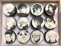 cupcakes decorated with anime characters are in a box