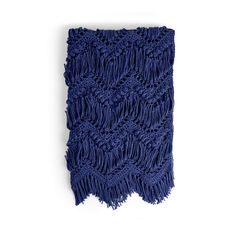 a blue scarf with fringes hanging on a wall