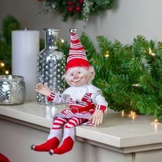 a small elf doll sitting on top of a counter