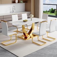 a white and gold dining table with four chairs in a modern style kitchen, next to a large window