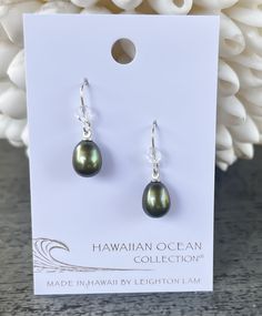 A classic freshwater pearl earring to accentuate your style. We match each pearl by hand, but just like you, each pearl is unique. Length: 0.6" Materials: 9mm Freshwater Pearl. Czech Fire Polish Bead. Sterling silver ear wires. Collection: Hawaiian Ocean Collection French Hook Pearl Drop Earrings For Gift, Silver Teardrop Earrings With Pearl Charm As Gift, Oval Pearl Earrings For Gifts, Tahitian Pearl Drop Jewelry For Weddings, Classic Tahitian Pearl Earrings For Gift, Classic Tahitian Pearl Earrings As Gift, Tahitian Pearl Drop Wedding Jewelry, Wedding Tahitian Pearl Drop Jewelry, Briolette Pearl Earrings For Gift