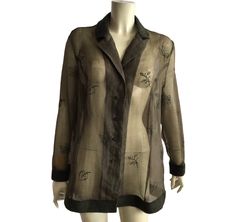 Gorgeous vintage sheer embroidered shirt in khaki color . The collar , cuffs and the end of the shirt are made from wool . Labeled as GB 20, IT 52, D 46 , fits like XL , but looks great oversize for smaller sizes . Chest 118 cm / 46 inches, length 76 cm / 29,9 inches . Material tag is missing . Perfect condition Elegant Long Sleeve Shirt With Floral Embroidery, Fitted Sheer Button-up Shirt, Sheer Fitted Button-up Shirt, Sheer Sleeves Button-up Tops For Fall, Sheer Collared Tops For Fall, Fall Sheer Sleeves Button-up Tops, Fall Button-up Top With Sheer Sleeves, Sheer Long Sleeve Shirt For Fall, Summer Button-up Top With Sheer Sleeves