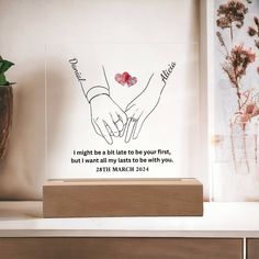 two hands holding each other on a shelf