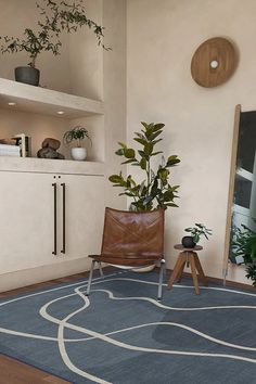 a living room with a blue rug and potted plants