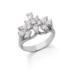 a white gold ring with three pear shaped diamonds on the side and leaves in the middle