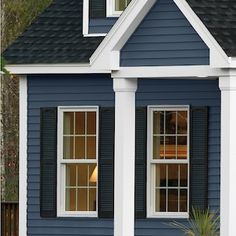 a gray house with black shutters and white trim