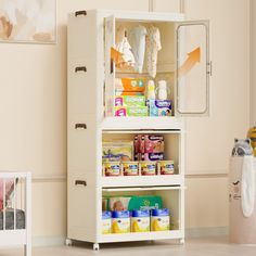 a baby changing table and cabinet in a room