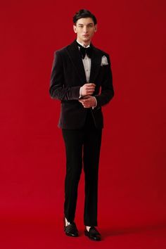 Black full sleeves tuxedo in velvet base with metallic embroidery and shawl lapel collar neckline. Paired with white cotton shirt, black trouser, bow, pocket square and waist band. - Aza Fashions Luxury Velvet Suits For Winter, Luxury Velvet Suit For Winter, Luxury Velvet Winter Suit, Elegant Festive Suits For Gala, Elegant Gala Suits For Festive Season, Elegant Gala Suits For Festive Occasions, Elegant Festive Gala Suits, Tailored Tuxedo Sets For Gala, Tailored Tuxedo For Gala And Festive Occasions