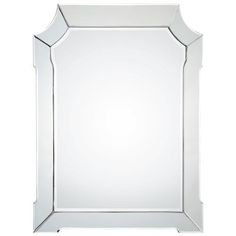 a large white mirror sitting on top of a table