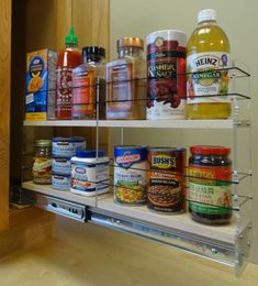 the shelves are full of food and condiments