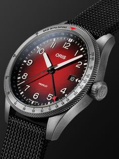 Oris' partnership with some of the world's finest aeromedical organisations leads to impressive technical innovation, the 'ProPilot' watch is equipped with a pulsometer to calculate heart rate. Engineered with an in-house calibre 798 movement, this PVD-coated stainless steel reference has a striking red gradient dial with a central GMT hand, date window and Super-LumiNova® coated numerals and indices for legibility. The durable canvas strap is even lined with supple leather for all-day comfort.… Red Formal Watch With Date Indicator, Formal Red Watch With Date Indicator, Luxury Red Watch With Date Indicator, Luxury Red Watches With Date Indicator, Red Watch With Date Indicator And Round Dial, Classic Red Watches With Date Display, Classic Red Watch Accessories With Date Indicator, Red Chronograph Watch For Formal Occasions, Luxury Red Analog Display Watch