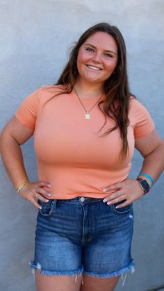 A peach baby short-sleeved top. It has a slight crop, size up for more length. Fit: True to size Small: 2-4 Medium: 6-8 Large: 10-12 The model is wearing a large. Laundry: wash on cold Pearl Accessories, Skirt Jumpsuit, Just Peachy, Baby Shorts, Kids Outerwear, Knit Sweatshirt, Sweatshirt Dress, Outerwear Women, Affordable Fashion