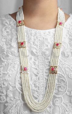 These Rani Haar Malas are Multi-layered strands of lustrous pearls intricately designed with gold detailing, perfect for weddings, festivals, and grand celebrations. Each piece is meticulously handcrafted by skilled artisans, ensuring superior quality and intricate designs. Our jewelry complements both traditional Indian and Pakistani attire and contemporary outfits, making it a versatile addition to your collection. 💖 Why Choose Us? *Authenticity: We use high-quality materials to ensure each p Pearl Pendant Necklace For Festivals, Festival Pearl Necklace With Pearl Pendant, Pearl Necklace With Pearl Pendant For Festivals, Pearl Necklace For Festivals And Gifts, Bridal Pearl Necklace With Pearl Pendant For Festivals, Festive Pearl Charm Jewelry, Festive Gift Pearl Necklace, Festive Kundan Pearl Drop Necklace, Festive Pearl Necklace With Pearl Chain