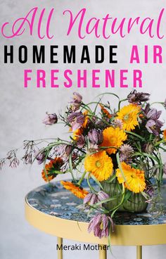 a table with flowers on it and the words, all natural homemade air freshener