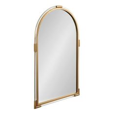 a gold and white arched mirror