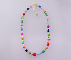 Brighten up your look with this colorful handmade necklace. It features a mix of vibrant Czech beads, natural gemstones, glass beads, and unique handpainted beads. Length: 16 inches with 2-inch adjustable chain. *Beads may vary slightly Colorful Adjustable Beaded Necklace With Polished Beads, Colorful Adjustable Beaded Necklaces With Polished Beads, Multicolor Polished Czech Glass Beaded Necklaces, Adjustable Multicolor Crystal Necklace With Colorful Beads, Multicolor Polished Czech Glass Beaded Necklace, Multicolor Czech Glass Crystal Necklaces With Round Beads, Multicolor Crystal Beach Necklace With Colorful Beads, Multicolor Crystal Necklace For Beach With Colorful Beads, Beach Multicolor Crystal Necklace With Colorful Beads