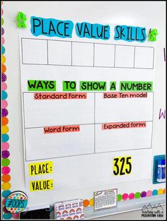 a bulletin board with numbers and place value skills displayed on it's whiteboard