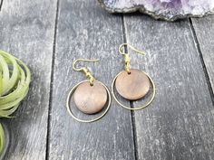 "These lightweight dangle earrings feature 18mm dark brown unfinished wooden discs dangling inside 25mm gold plated brass hoops. The ear wires are made of hypoallergenic gold plated surgical steel, making these earrings safe for sensitive ears! They are super lightweight, each weighing only 0.1 ounce. They measure approximately 1.75 inches from the top of the ear wires to the bottom of the gold hoop. Domestic shipping is always free here at Mayamadethis! When will my item ship? Every single item Round Wooden Earrings As Gift, Round Wooden Earrings For Gifts, Handmade Round Wooden Earrings, Handmade Wooden Round Earrings, Wooden Round Earrings For Gifts, Wooden Round Earrings Gift, Hypoallergenic Brown Round Earrings, Brown Wooden Round Earrings, Brown Round Earrings For Pierced Ears