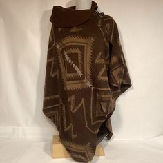 Lauren Ralph Lauren Cape Poncho Made In Italy With Southwestern Aztec Design. Cape Is Wool Blend 75% Lambswool 25% Nylon. Warm And Comfortable Cape Poncho Is One Size Fits All Condition Is Very Nice Vintage Pre Owned Please See All Photos Wild West Poncho, Rustic Brown Outdoor Outerwear, Native American Shawl, One Size Brown Cape Outerwear, Brown Cape For Cold Weather, Cozy Brown Poncho For Outdoor, Southwestern Brown Outerwear For Fall, Southwestern Style Brown Outerwear For Fall, Brown Long Sleeve Poncho For Outdoor