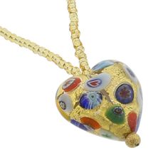 Every woman loves to own unique handcrafted jewelry. This Murano necklace in rich gold and millefiori palette is every woman's dream, rich and beautiful like Venice itself. The authentic Murano necklace features an exquisite 24K gold-layered heart pendant suspended from an elegant gold-lined beaded necklace accented with gorgeous 24K gold-lined and millefiori Murano glass beads. Enjoy this unique Murano Necklace and the aura of Venetian romance and elegance that it projects. Measurements: The he Gold Heart Beads Necklace For Gift, Gold Necklaces With Heart Beads For Gift, Elegant Multicolor Necklace For Anniversary, Gold Heart Beads Pendant Necklace, Gold Pendant Necklace With Heart Beads, Elegant Multicolor Heart Beads Necklace, Gold Necklaces With Heart Beads For Jewelry Making, Gold Murano Glass Jewelry For Gifts, Gold Murano Glass Jewelry As Gift