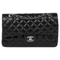 Chanel Black Quilted Lambskin Medium Classic Double Flap Bag Brand- Chanel Model- Medium Classic Double Flap Bag Product Type- Crossbody, Shoulder Serial Number- 10****** Age- Circa 2005 Accompanied By- Chanel Dust Bag, Box, Authenticity Card Colour- Black Hardware- Silver Material(s)- Lambskin Leather Authenticity Details- Serial Sticker, Authenticity Card Height- 15cm Width- 25cm Depth- 7cm Strap Drop- Single: 24cm Double: 43cm Interior- Burgundy Leather Closure- Turn Lock Country of Origin- F Classic Bags With Palladium Hardware And Double Flap, Classic Bag With Palladium Hardware And Double Flap, Business Bags With Silver-tone Hardware And Double Flap, Designer Bags With Silver-tone Hardware And Double Flap, Luxury Double Flap Bag With Silver-tone Hardware, Luxury Bags With Silver-tone Hardware And Double Flap, Luxury Bag With Silver-tone Hardware And Double Flap, Classic Bags With Double Flap And Silver-tone Hardware, Double Flap Bags With Palladium Hardware