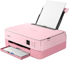 a pink printer sitting on top of a white table