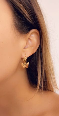 This Summer's must-have piece. Grab a pair of these dainty, trendy and minimalist Butterfly hoops. Material: 18KT Gold Filled Earring Drop is approximately 15mm. Proper Care for your new MaLiBeads: Gold Filled products are durable; however, please remember to apply beauty products such as perfume, hairspray or deodorant before wearing your jewelry as certain chemicals in these products may damage the finish. Always remove your jewelry before swimming, bathing, doing household chores or using abr Everyday Dainty Earrings With Butterfly Charm, Dainty Hoop Earrings With Butterfly Charm, Dainty Butterfly Earrings For Everyday Wear, Dainty Butterfly Charm Earrings, Minimalist Butterfly Earrings For Everyday Wear, Minimalist Butterfly Earrings For Everyday, Dainty Tiny Butterfly Earrings, Tiny Dainty Butterfly Earrings, Tiny Butterfly Dainty Earrings