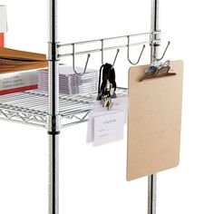 a metal shelf with clipboards and binders on it