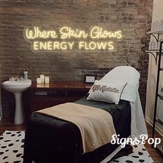 there is a neon sign that says where skin glows energy flows on the wall