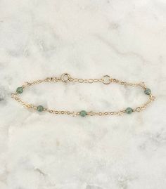 This dainty aventurine bracelet is handmade with genuine aventurine, and 14k gold filled and sterling silver metals. - Each bead measures 3mm. - Waterproof - Will not tarnish - Size up and wear as an anklet All of our jewelry is handmade with love in Nova Scotia, Canada. Bracelet Sizing: 5.5 - 6.5 Inches (extra small) 6.5 - 7.5 Inches (small) (standard size) 7.5 - 8.5 Inches (medium) 8.5 - 9.5 Inches (large) (anklet size)  METALS Our jewelry is made using 925 sterling silver or 14k gold filled m Gold Aventurine Bracelets As Gift, Gold Bracelets With Aventurine Natural Stones, Gold Bracelets With Natural Aventurine Stones, Gold Bracelet With Semi-precious Stone For Gift, Adjustable Gold Aventurine Beaded Bracelets, Gold Beaded Bracelets With Natural Aventurine Stones, Gold Beaded Aventurine Bracelets With Natural Stones, Gold Beaded Bracelets With Aventurine Stones, Gold Aventurine Beaded Bracelets With Natural Stones