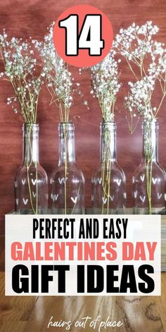 vases filled with baby's breath sitting on top of a wooden table